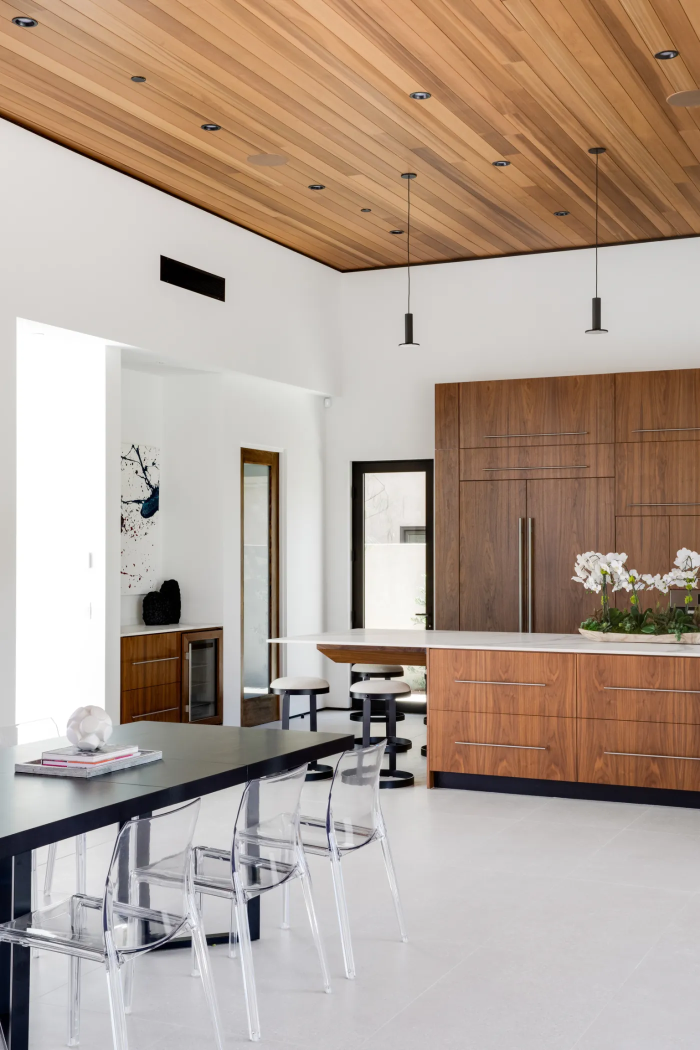 Kitchen with a wood ceiling and walnut cabinetry